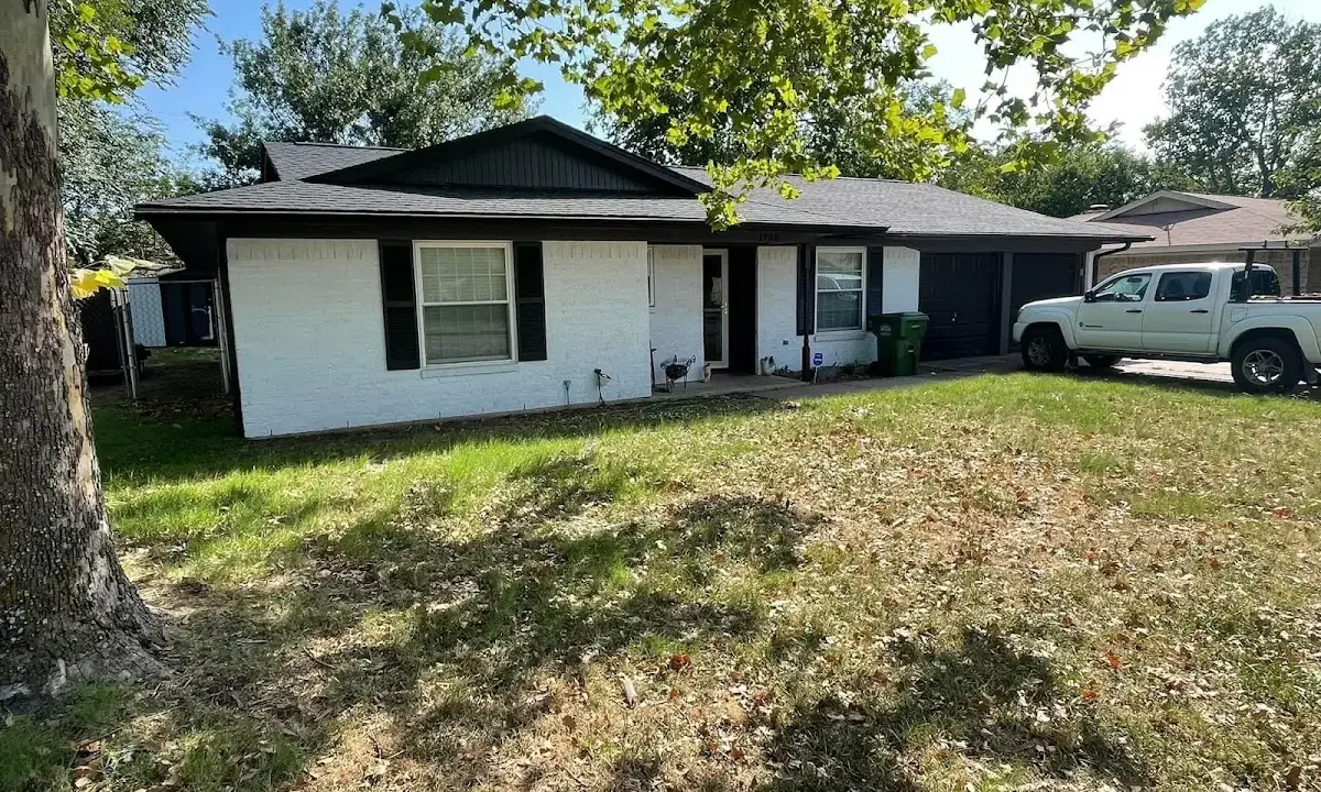 Professional roofing crew working on a residential roof in Auburndale